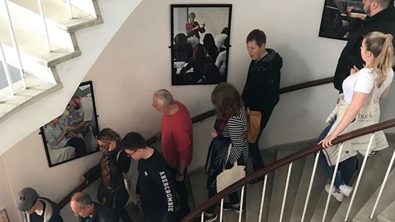 Staircase with people walking down it