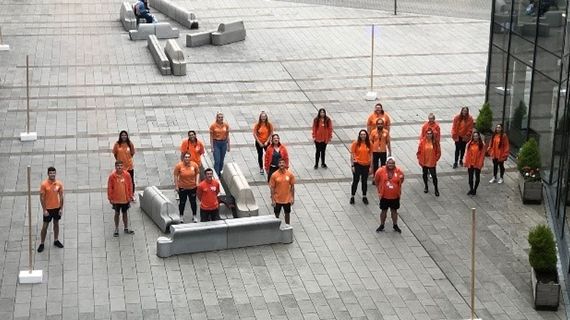 Student ambassadors in orange jumpers