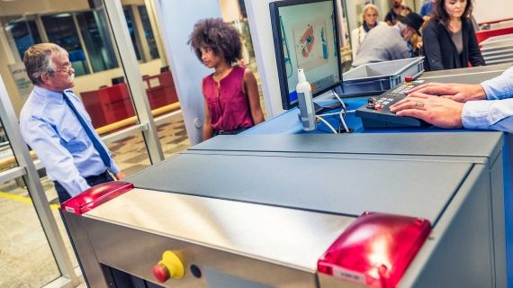 Female going through Airport Security 