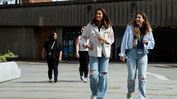 Two female students walking outside High Wycombe campus