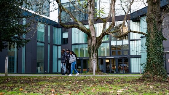 Group of three students walking outside High Wycombe campus