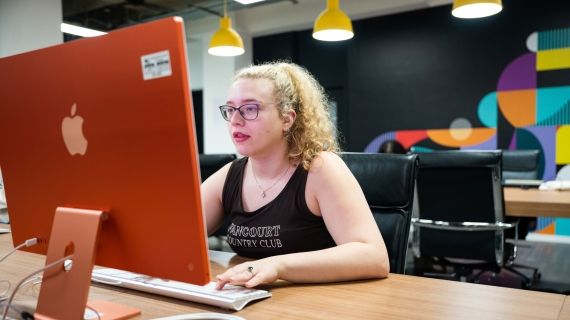 Creative Advertising student at laptop