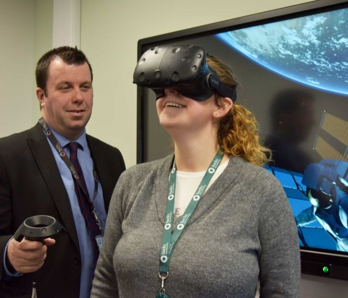 Female student wearing HTC VR software virtual reality psychology