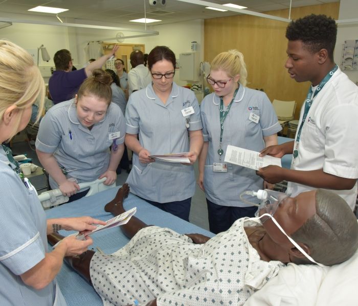 Group of Nursing students with mannequin 