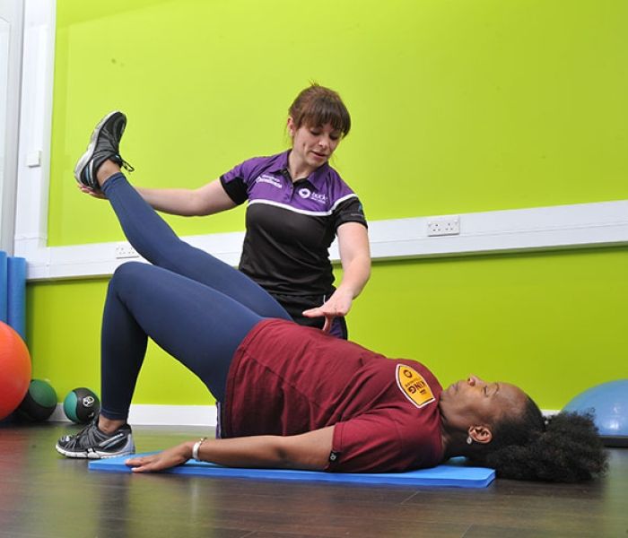 Lady stretching on the floor