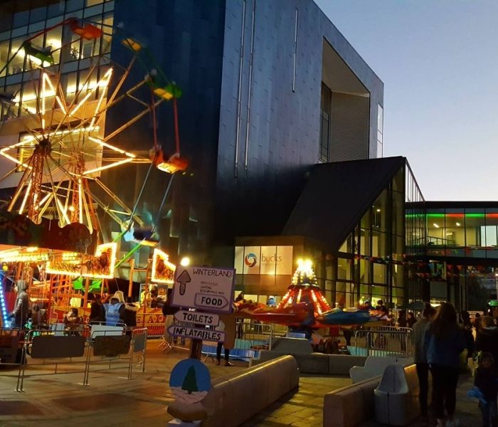 Gateway building with various rides at event