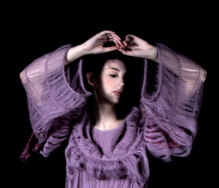 Fashion Design female student in outfit posing