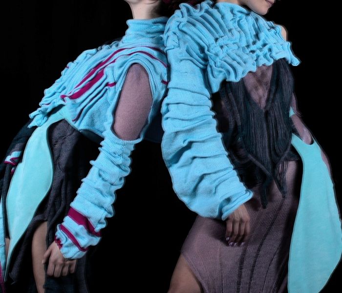 Fashion Design students in blue outfits posing