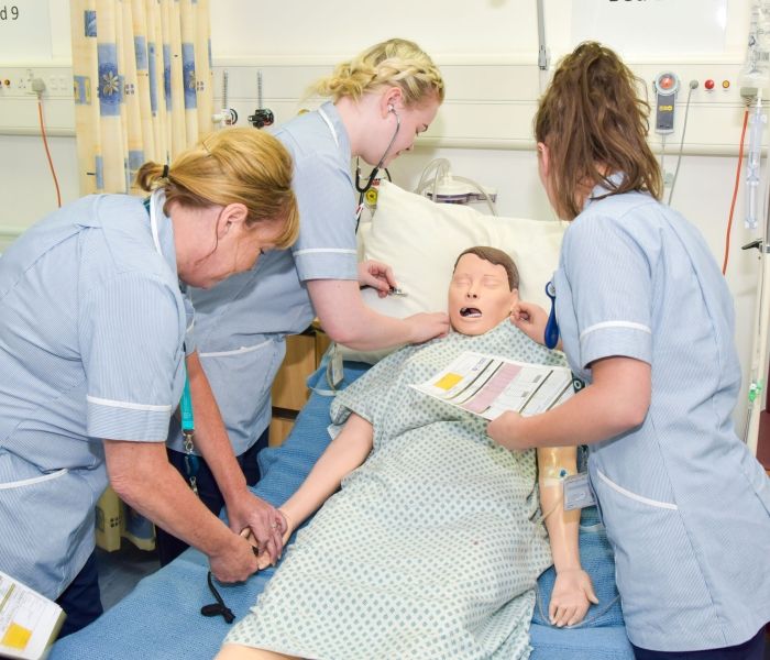 Three females nurses with manikin