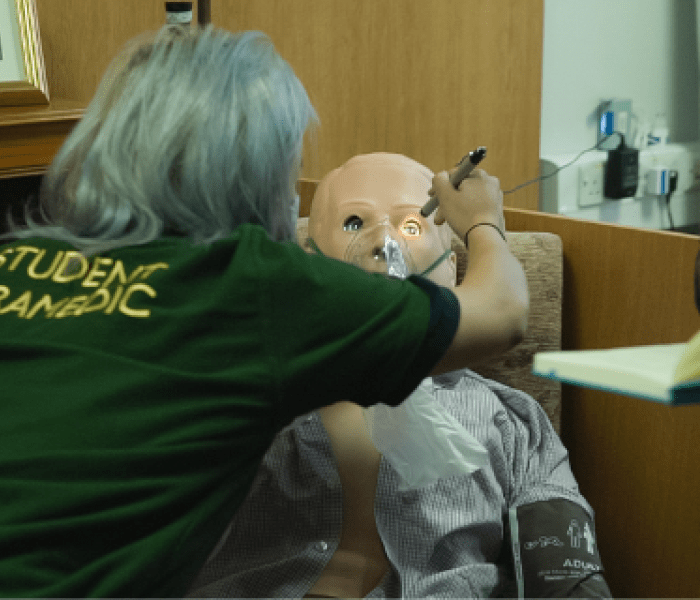 A student completing a medical assessment on one of our advanced patient simulators
