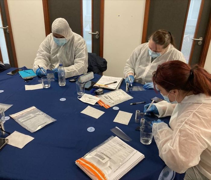 Criminology and Forensic Studies working at table with items