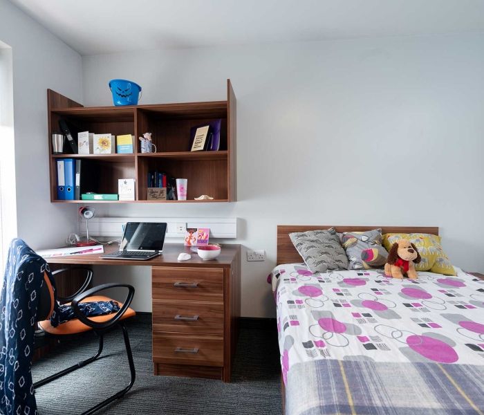 Windsor House bedroom including bed, desk, shelves