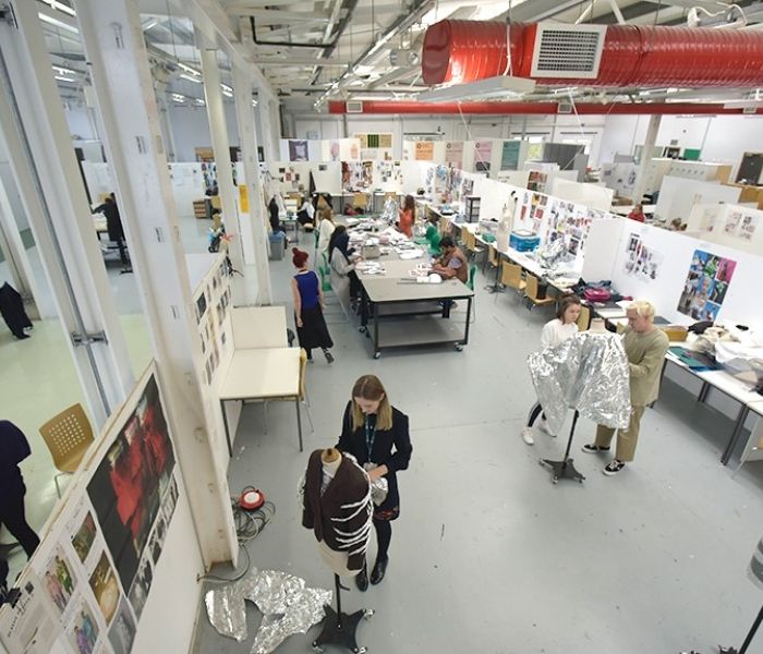 An aerial shot of the Red Shed building with students working on their projects