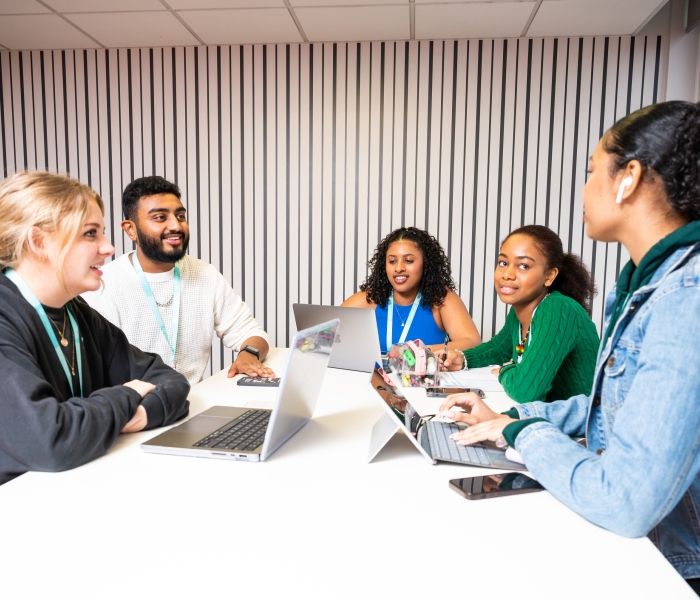 Students sat around a table 