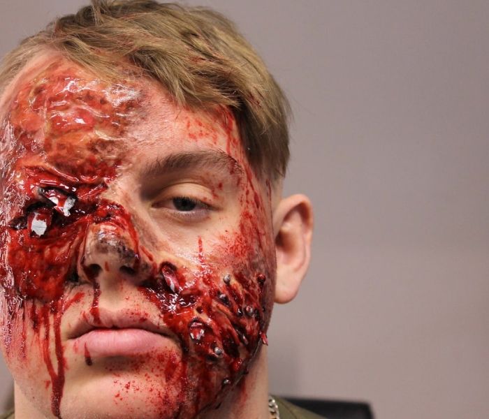A fake bloodied face of a student applied by a Special Effects student.
