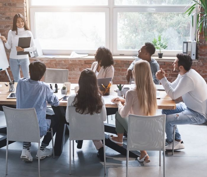 Students sat discussing business ideas