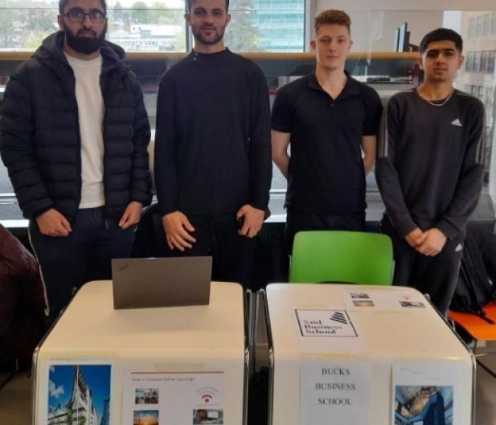 Business students presenting their work at the year-end showcase