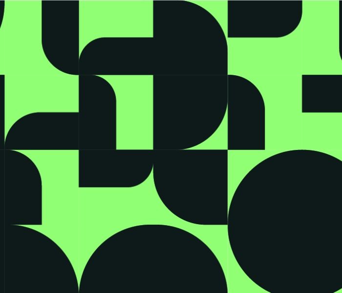 Green and black circles semi circles in a repeated pattern.