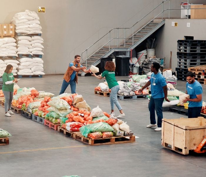 Group of people working in a food distribution warehouse