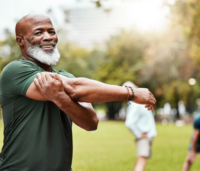 man stretching his arms