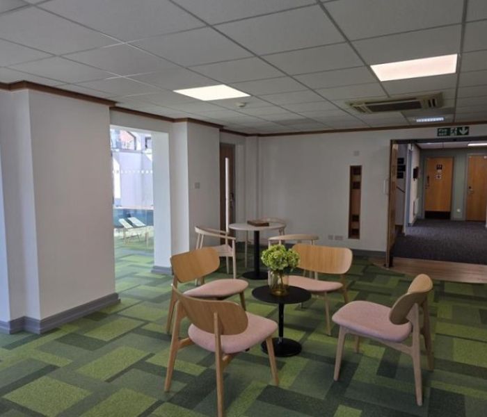 Communal space at Alex House with tables and chairs