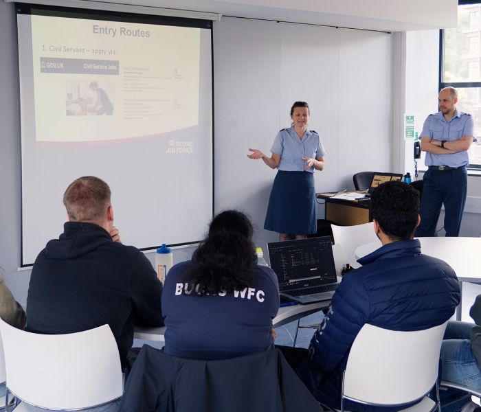 Royal Air Force medical services delivering a presentation to a group of students.