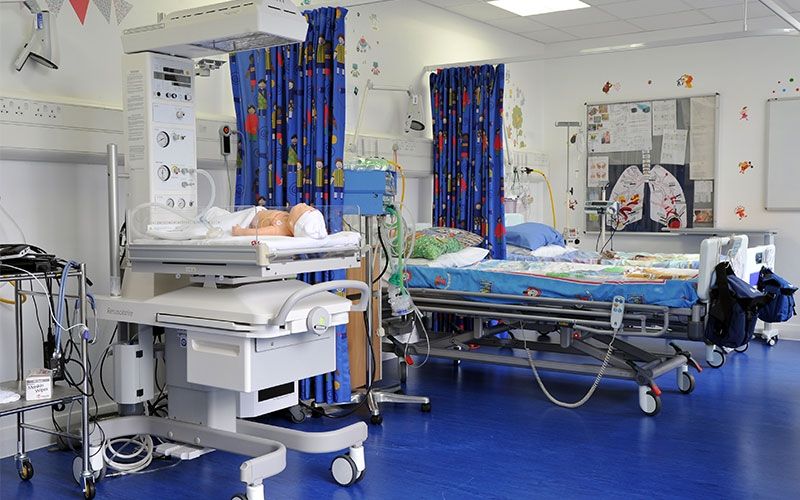 Simulation ward at Uxbridge Campus with beds and baby mannequin