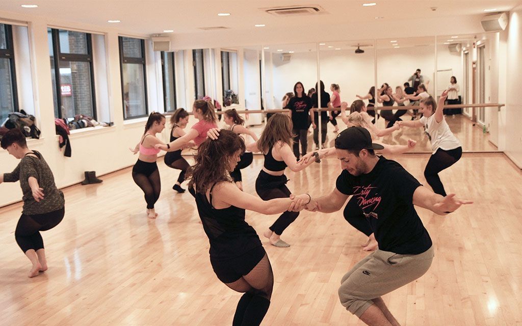 Couples dancing on a stage