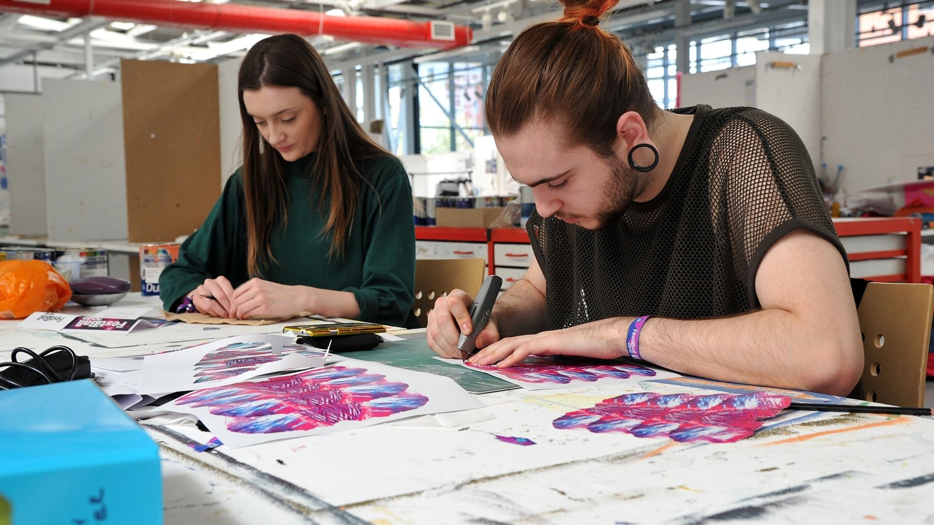 art and design students working on creatives