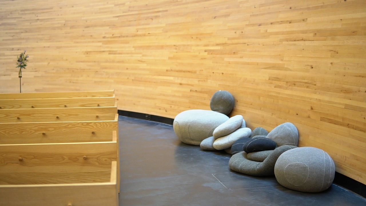 Rocks which are seats in a wooden hall