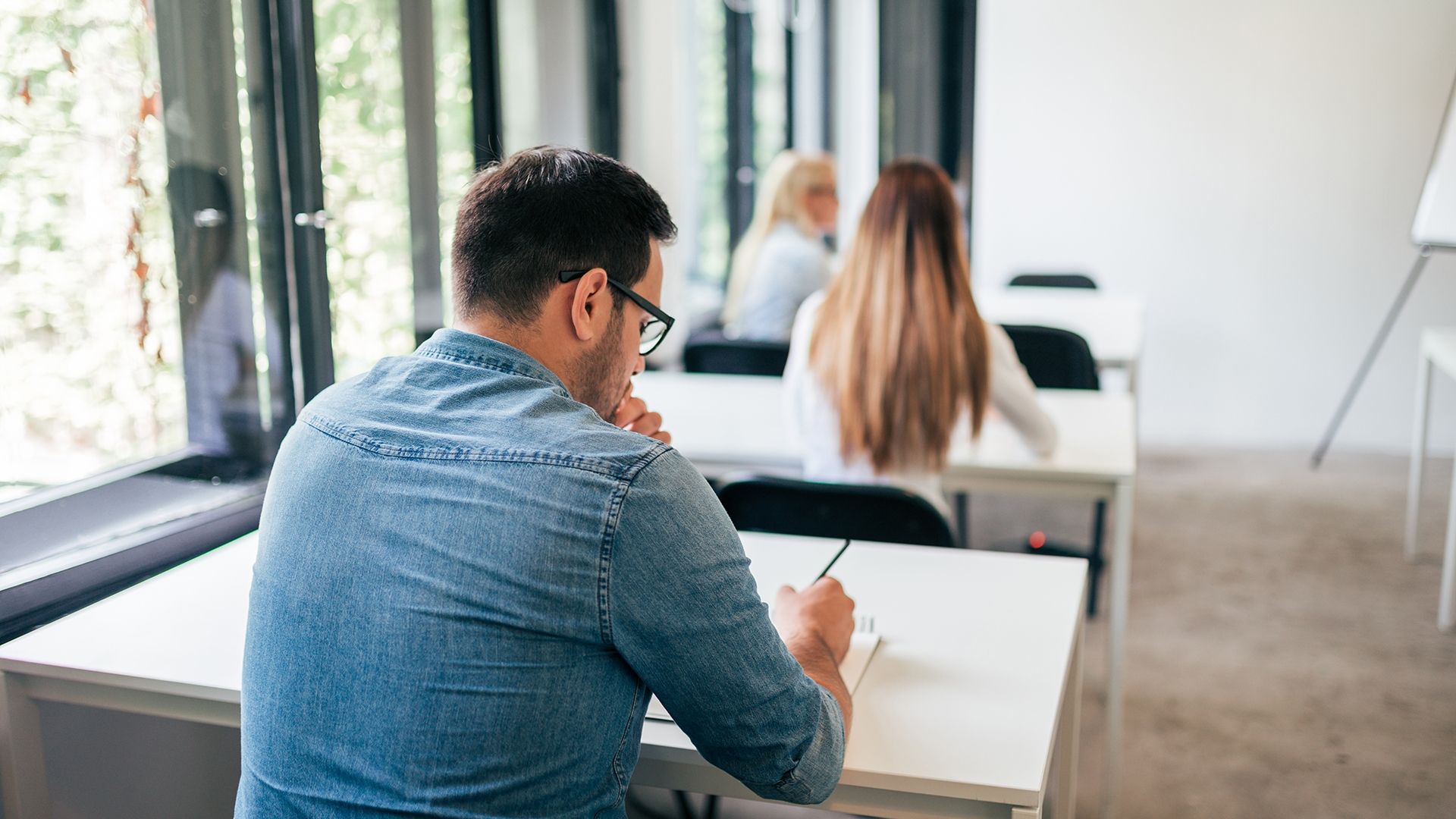 Student taking exam/working