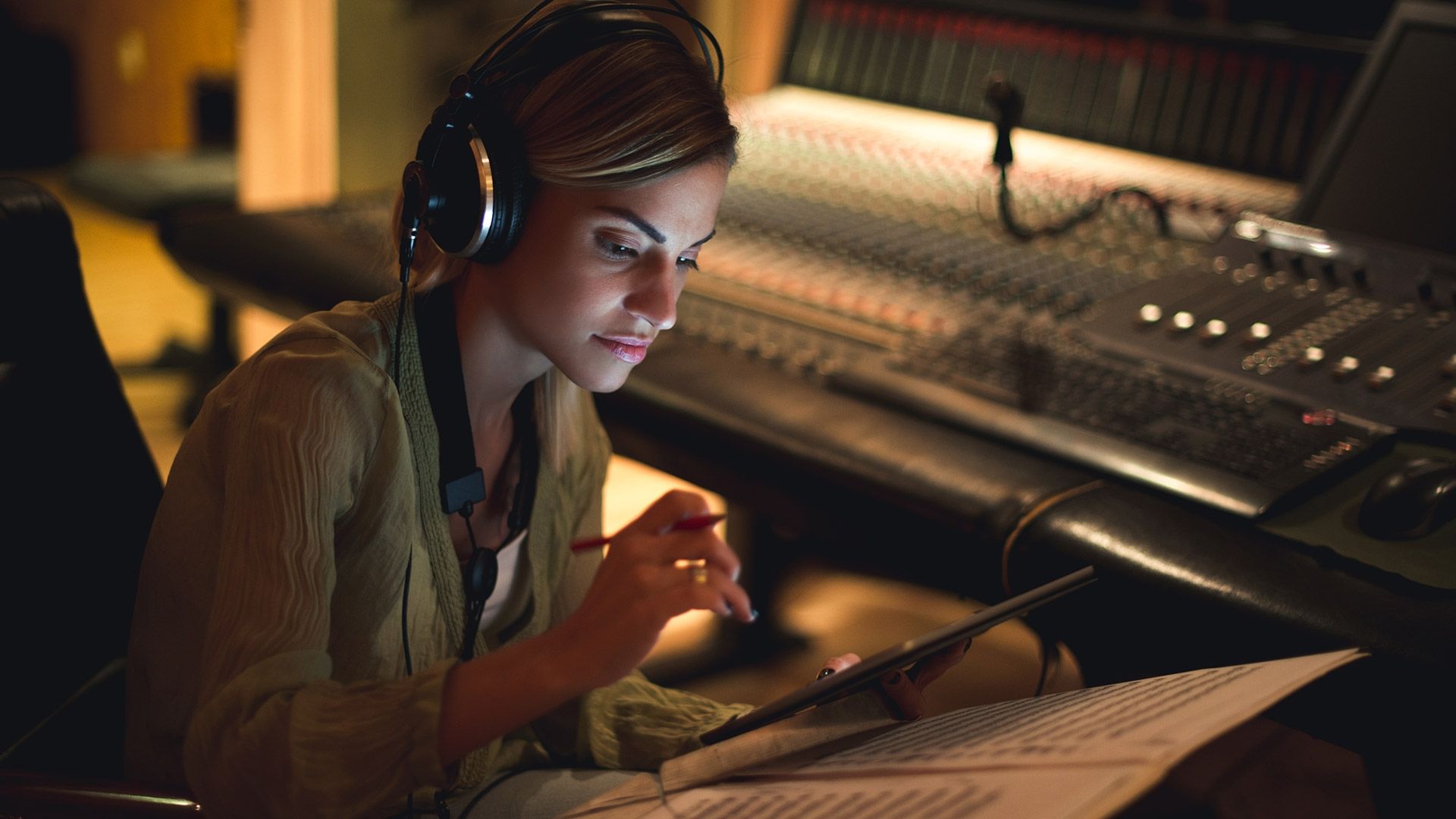 Source girl sitting down writing her next song
