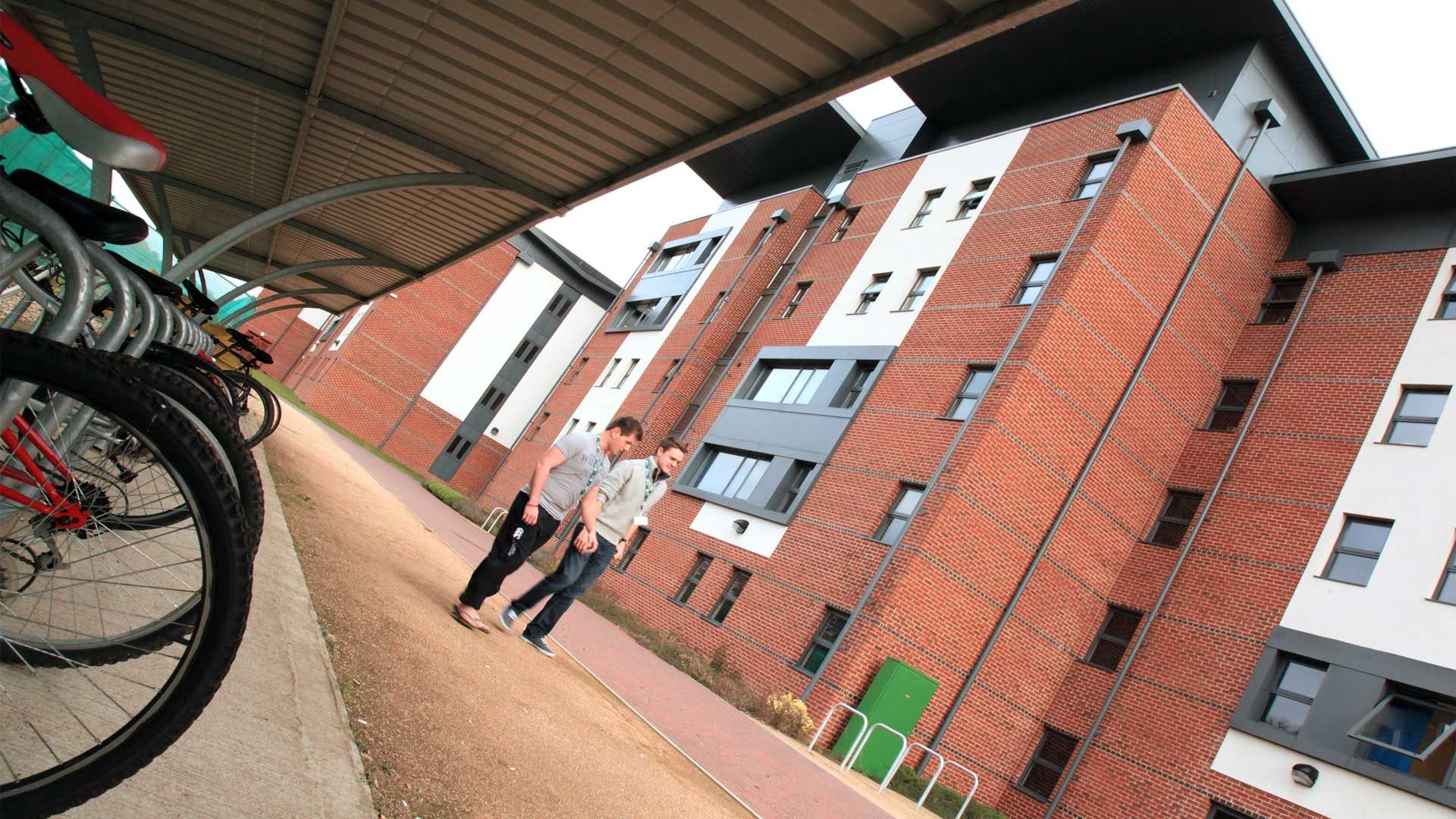 Two Bucks students walking outside Hughenden Park Student Village Accommodation