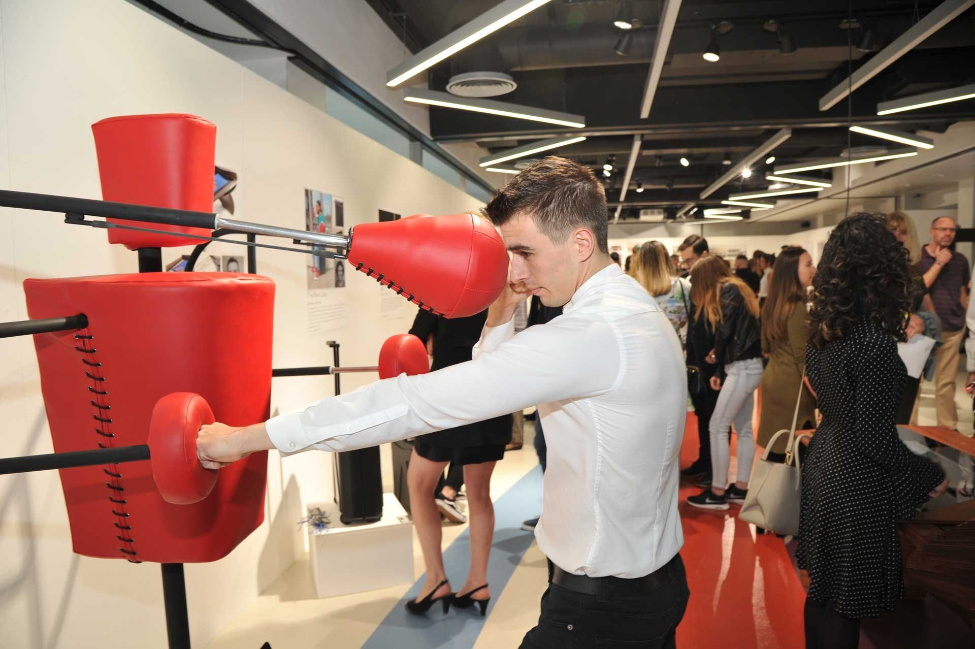 Male student testing out a boxing punch bag product
