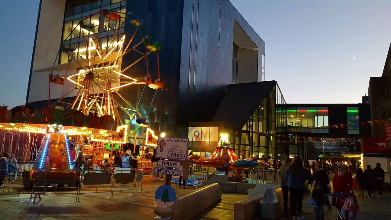 Gateway building with various rides at event