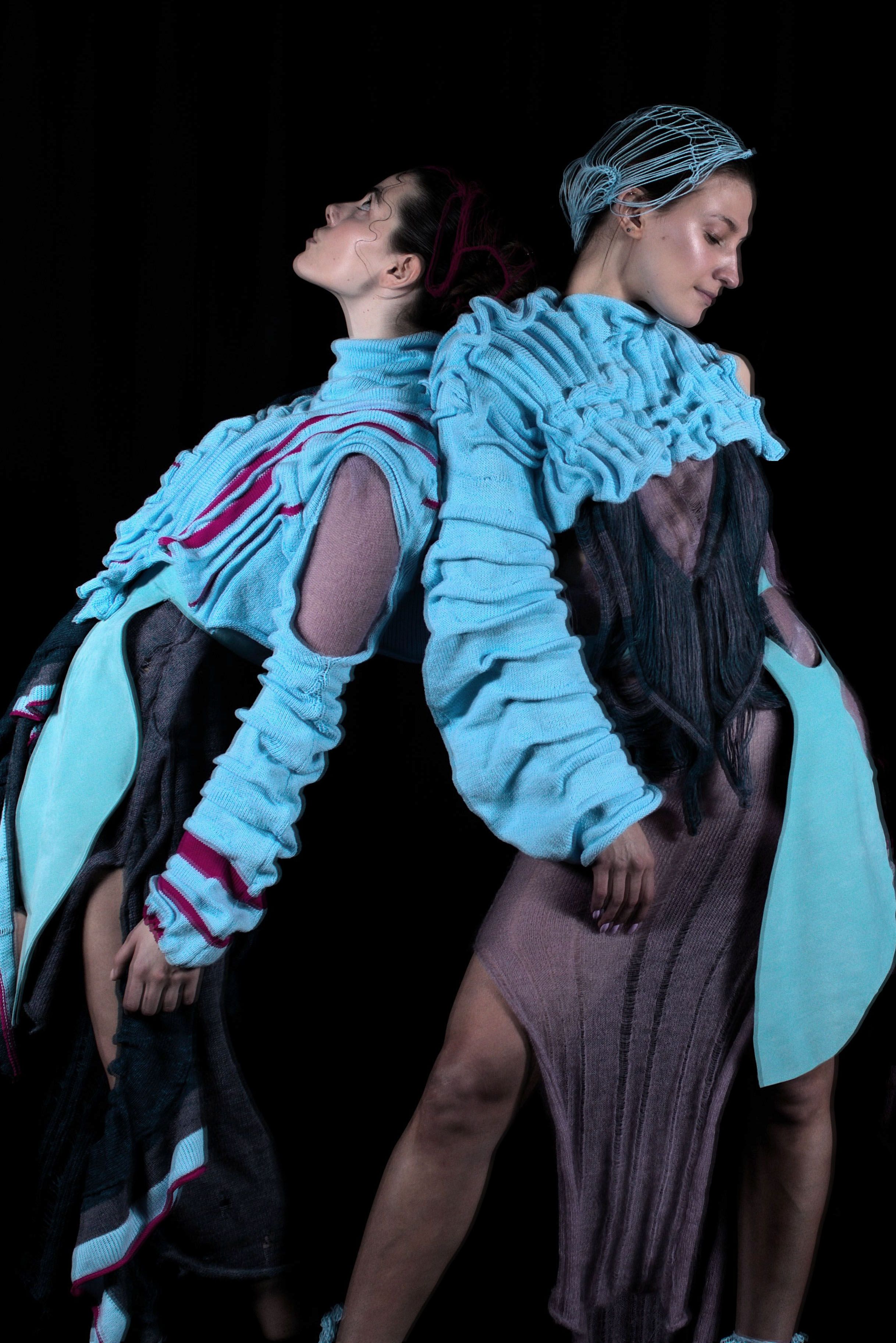 Fashion Design students in blue outfits posing