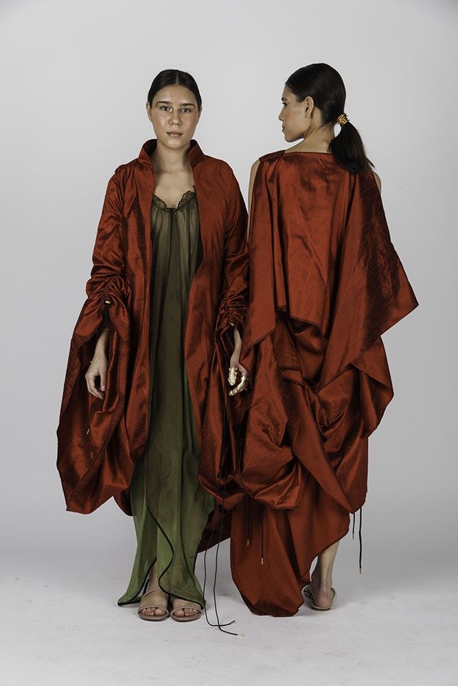 Fashion Design Students stood in red outfits