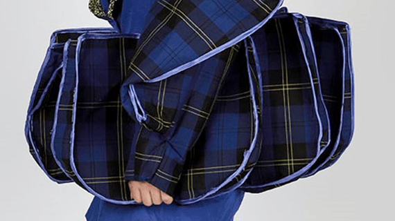 A close-up of a BNU Fashion and Textiles student wearing tartan blue clothes