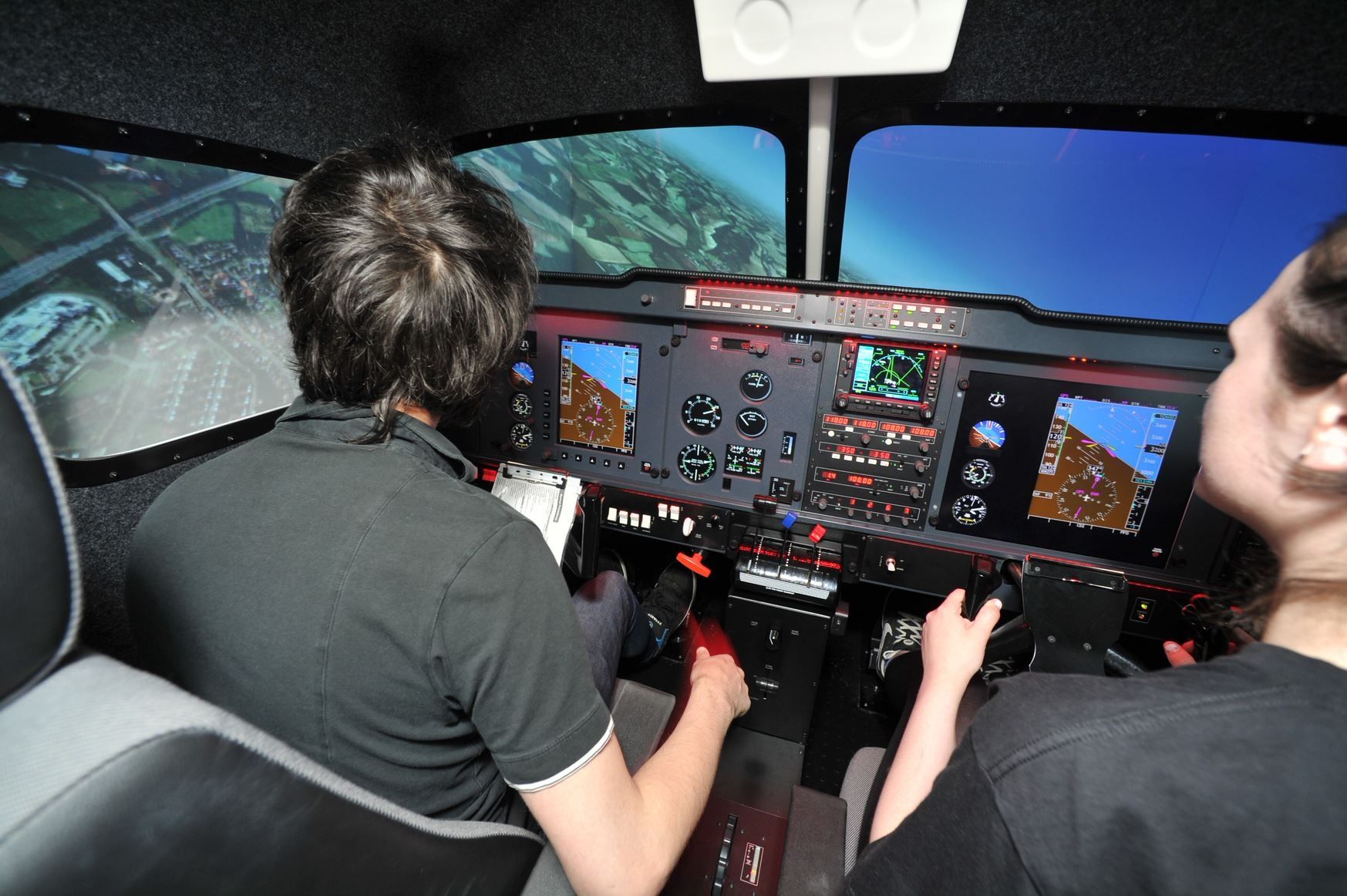 students in aviation simluator