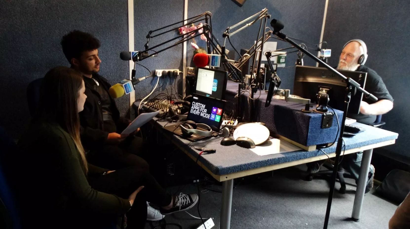 Music students recording in a studio