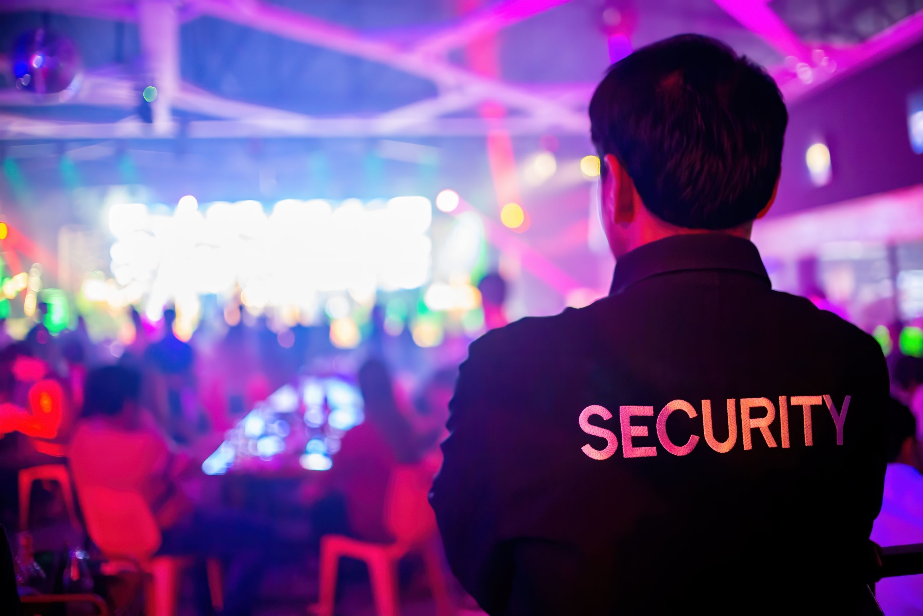 security guard overlooking a night event
