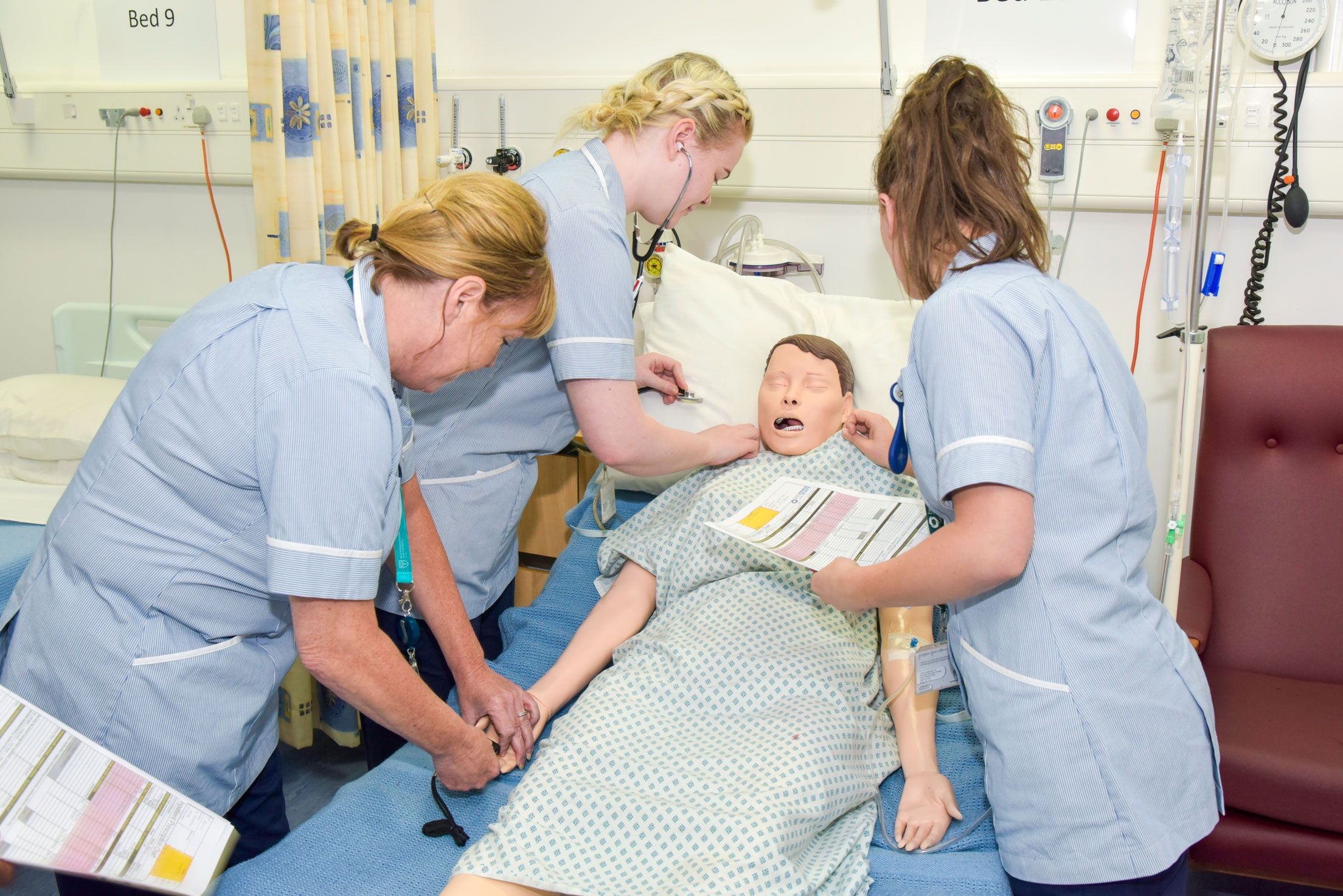Three females nurses with manikin