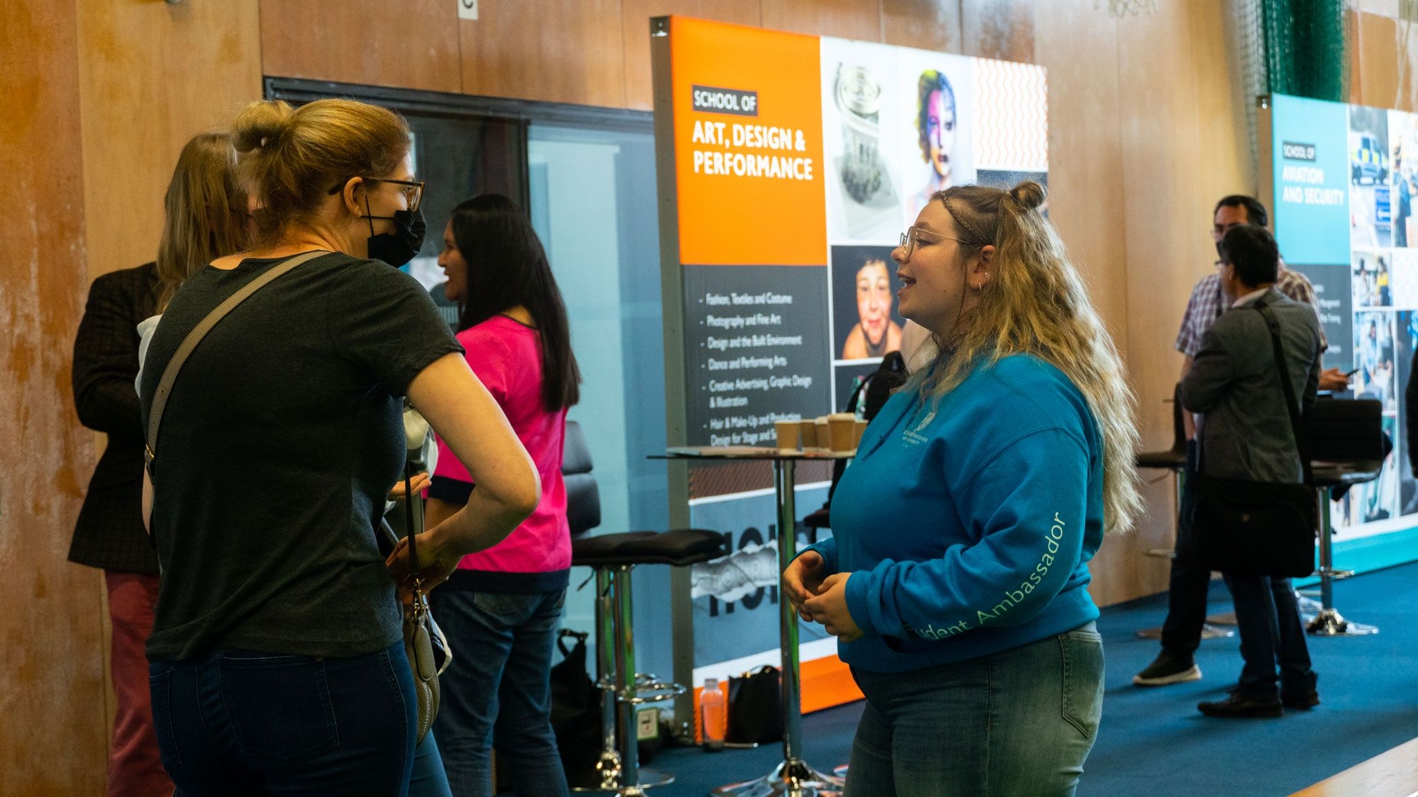 Student Ambassador talking to a parent at High Wycombe open day