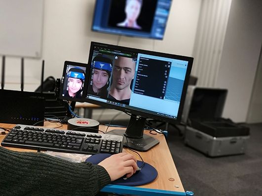 student using faceware software for media course