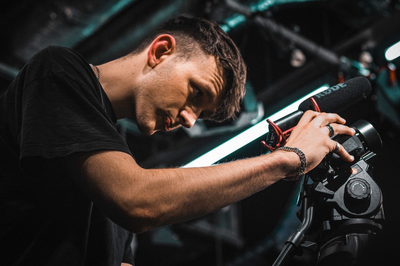 Film and television production student holding a camera and filming