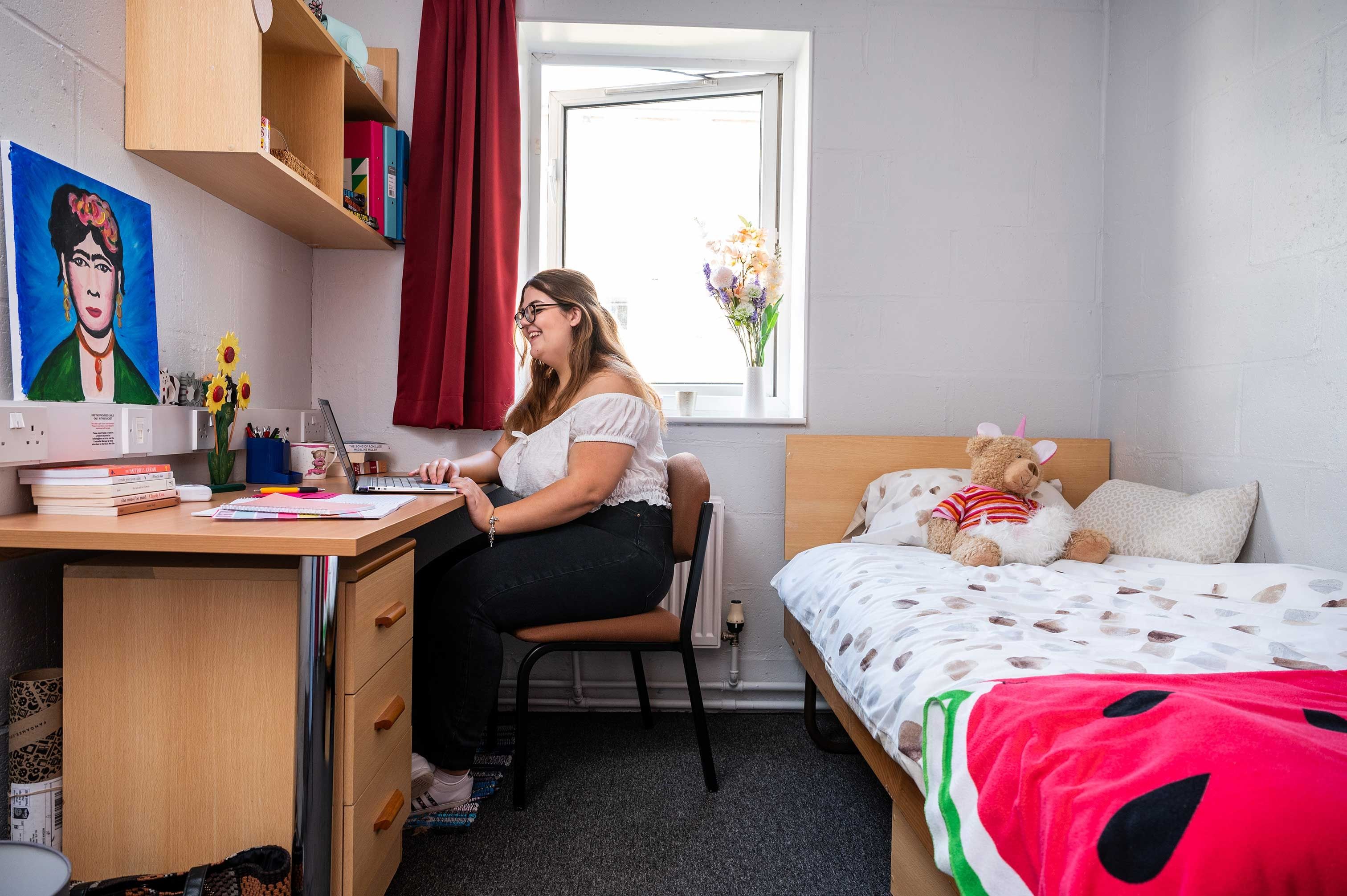 A student working at her desk in a Brook Street bedroom