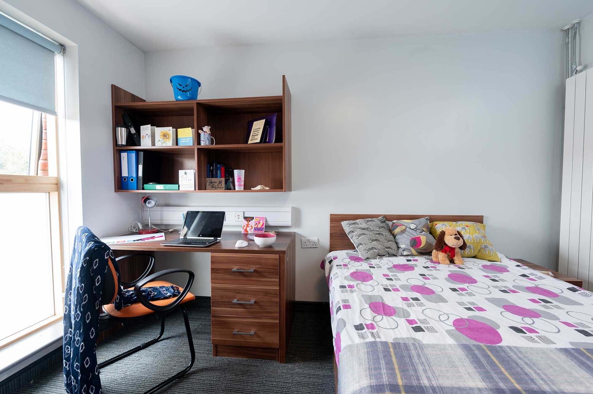 Windsor House bedroom including bed, desk, shelves