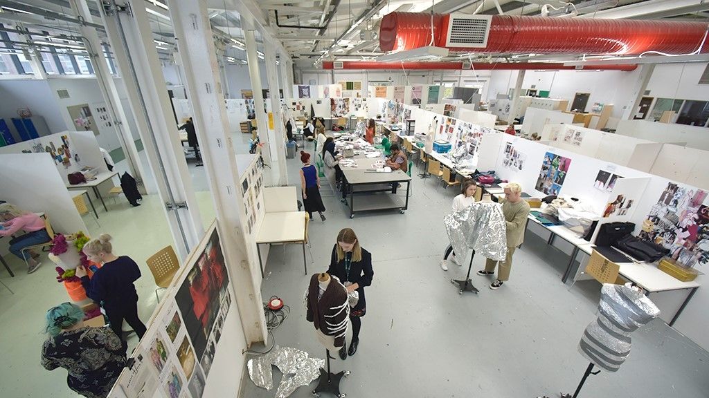 An aerial shot of the Red Shed building with students working on their projects