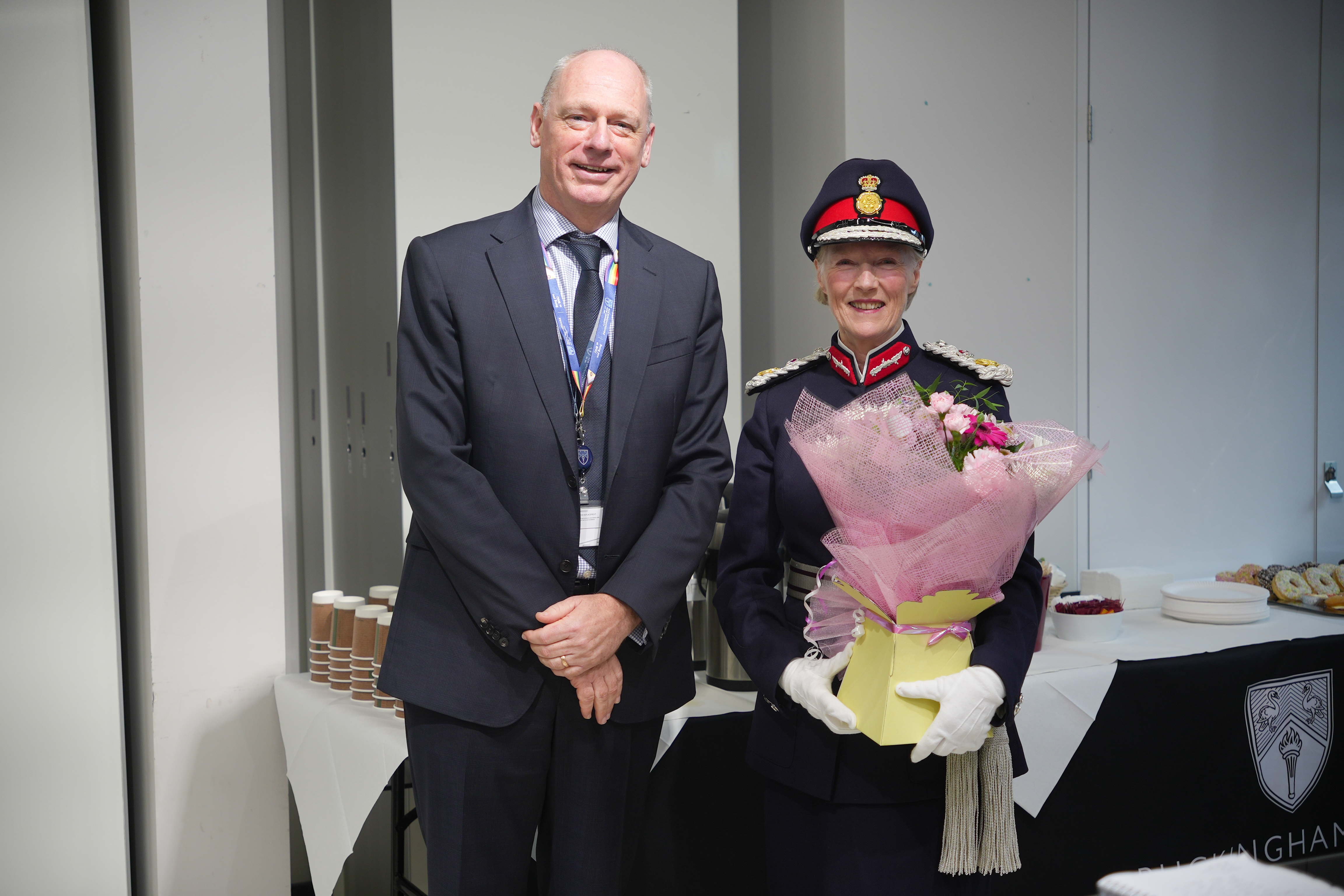The Countess Howe receives flowers from the Vice-Chancellor