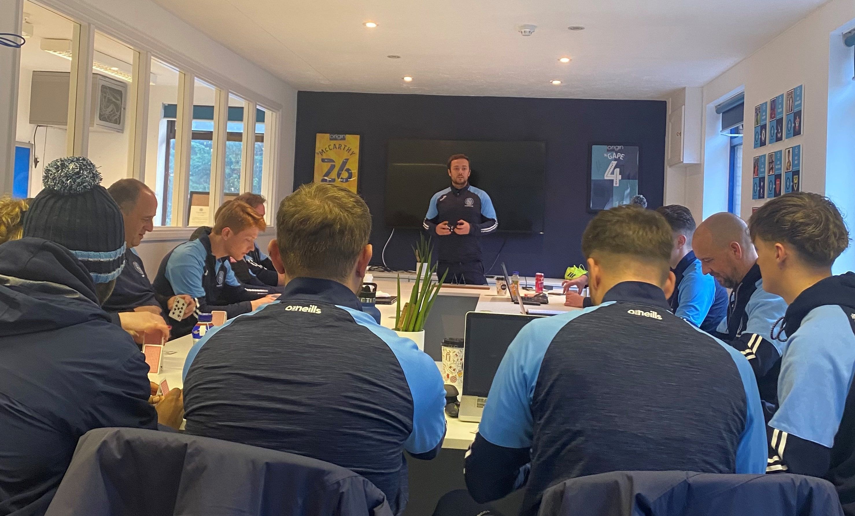 Wycombe Wanderers management team meeting around a table